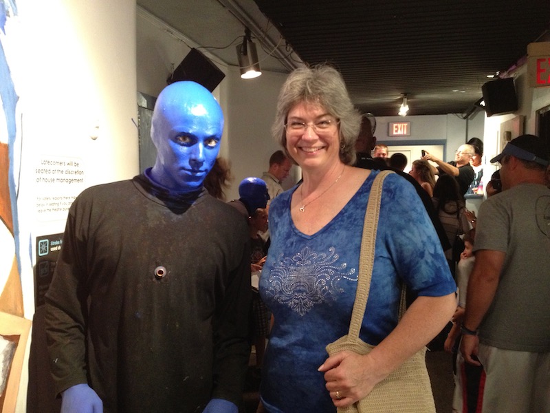 Blue man beside Melanie after show