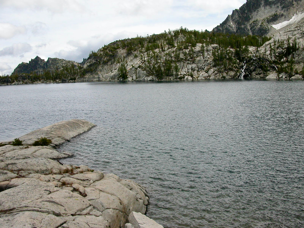 a lake with a rock point out into it