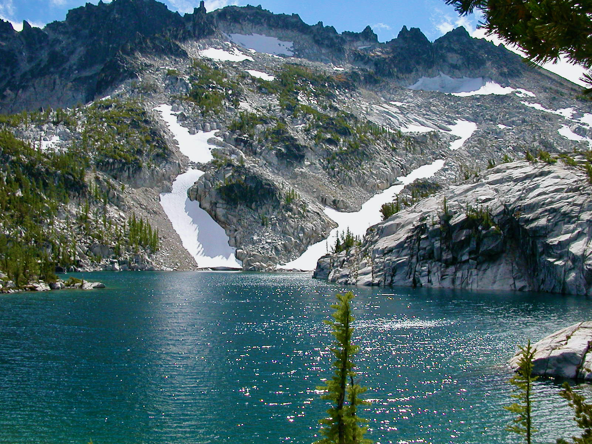 sparking lake with mountain background