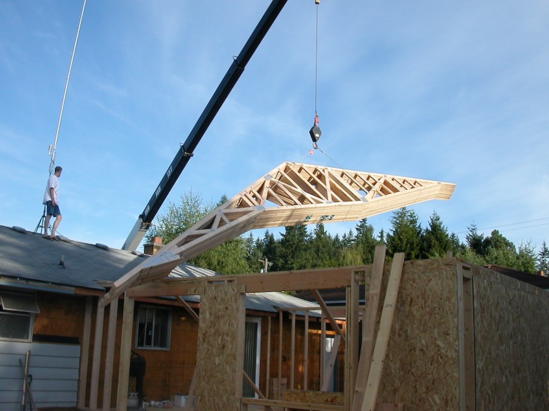 Trusses lifted over the house