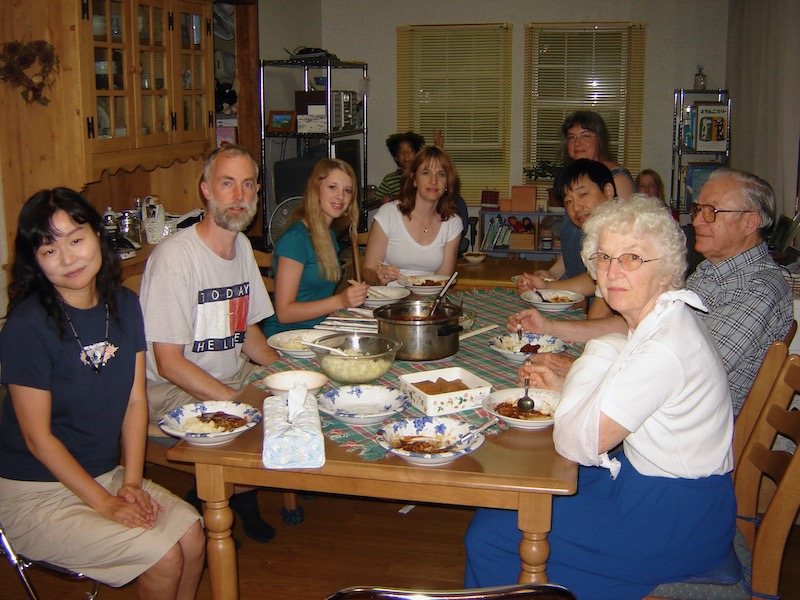 at dinner table with friends