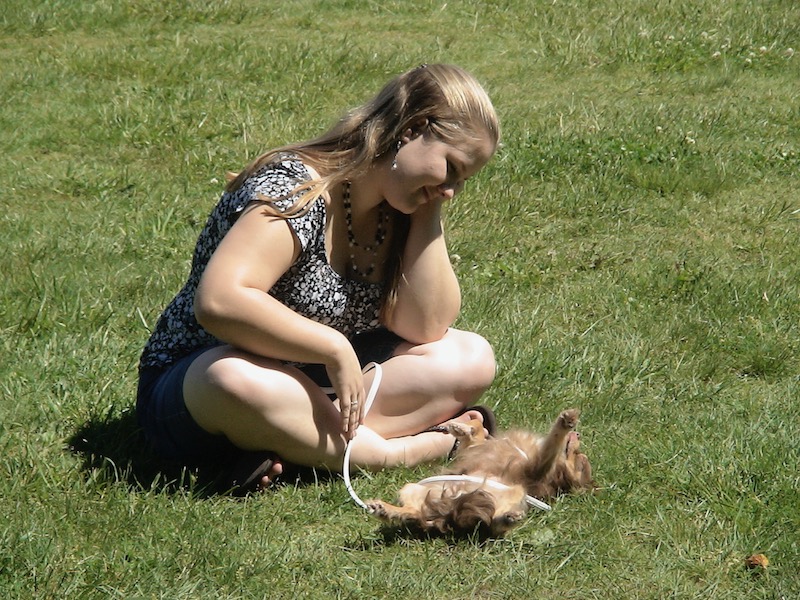 Janea and her dog on the grass