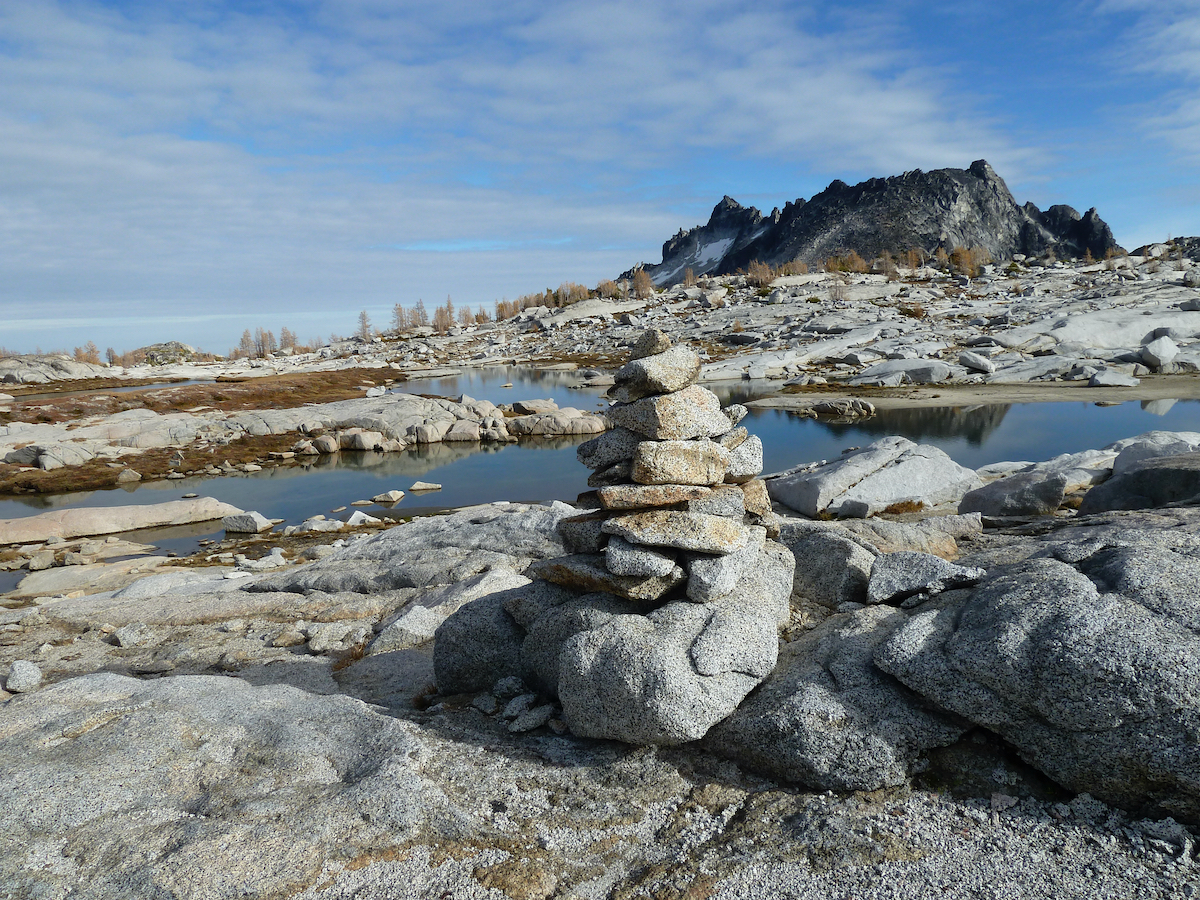 stack of rocks with lakes behind