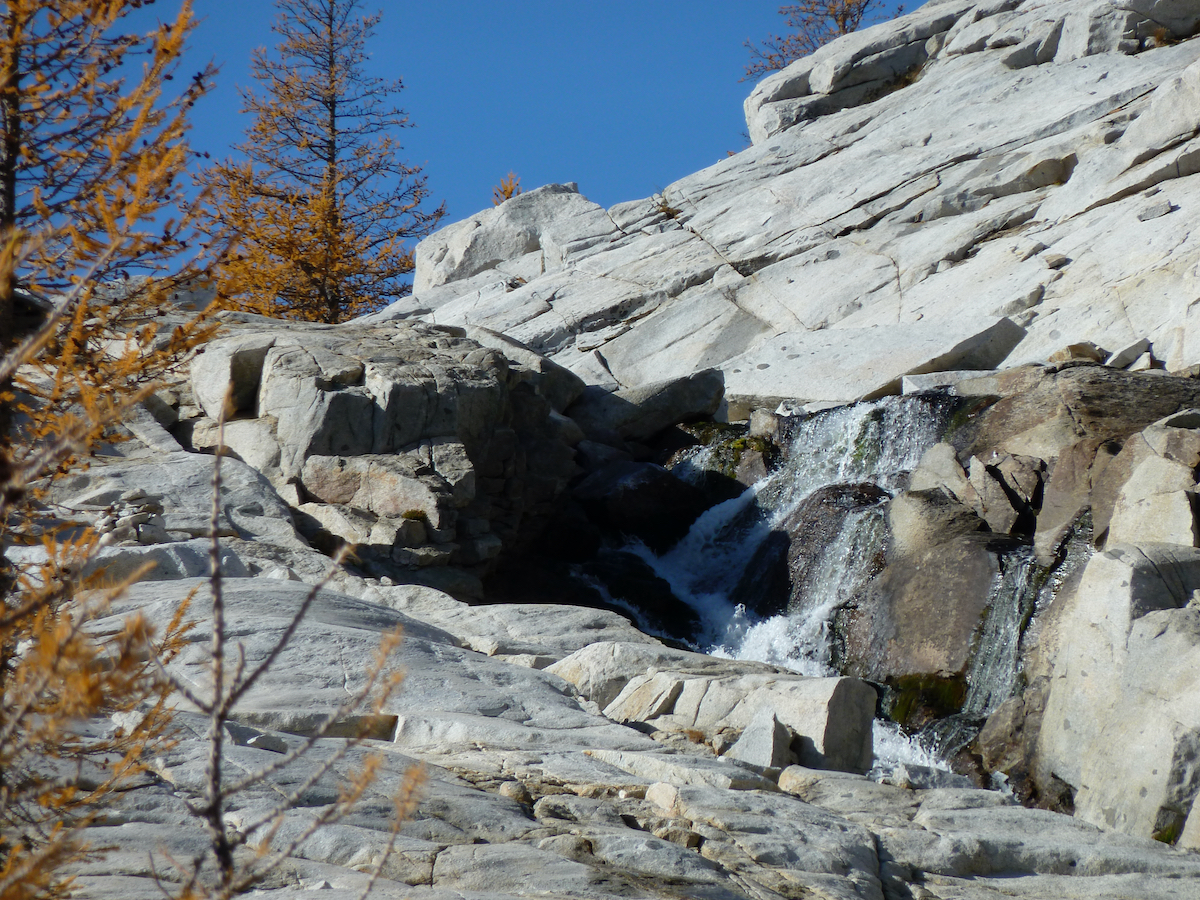 looking up at waterfall along rock