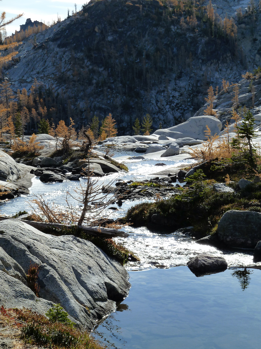 water coming through rocks to drop off edge