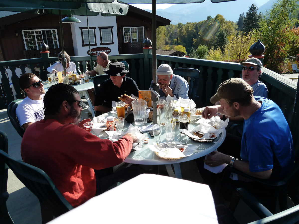 sitting around outside restaurant table in sunshine