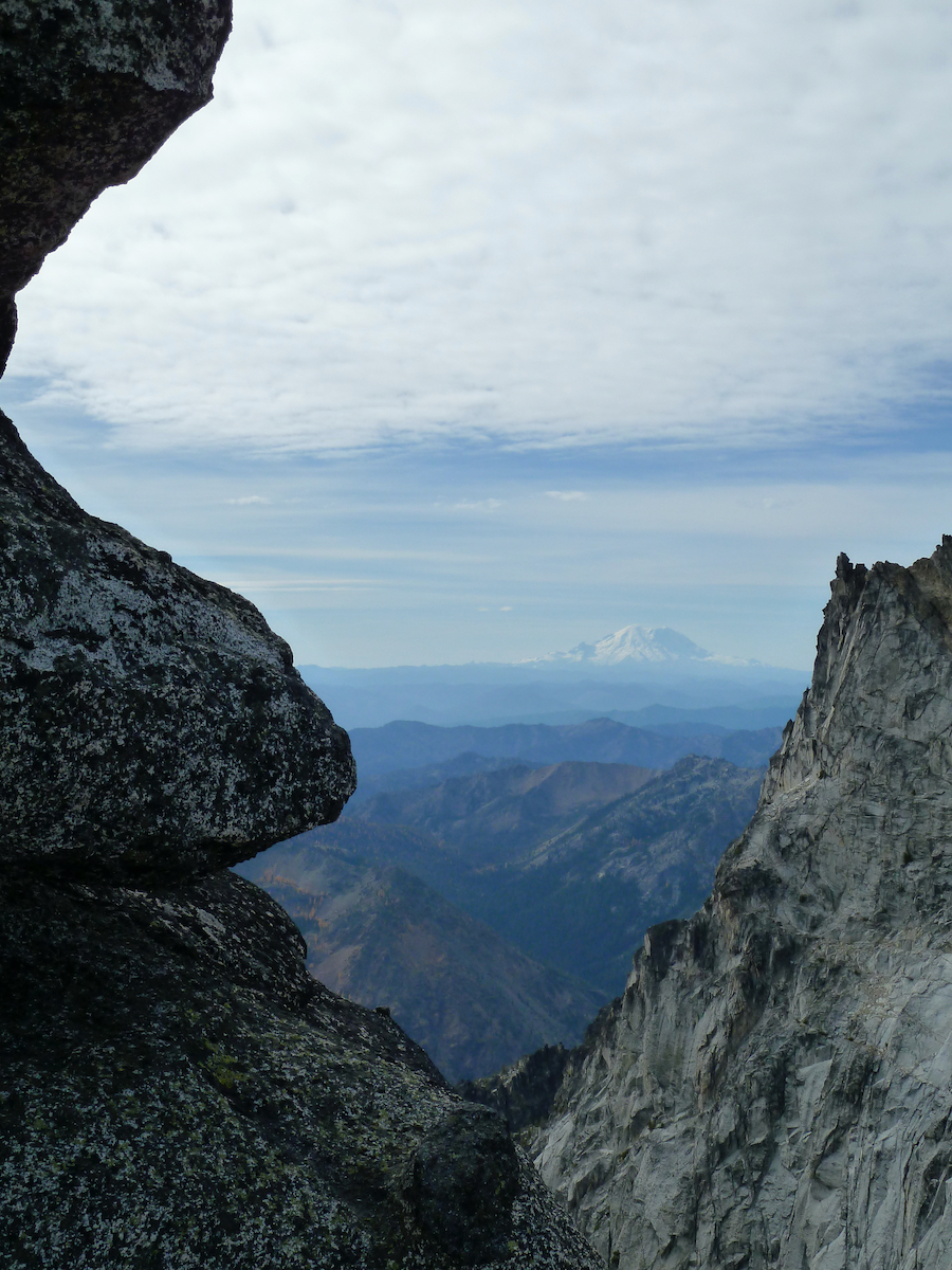 mountain seen through a gap in rocks