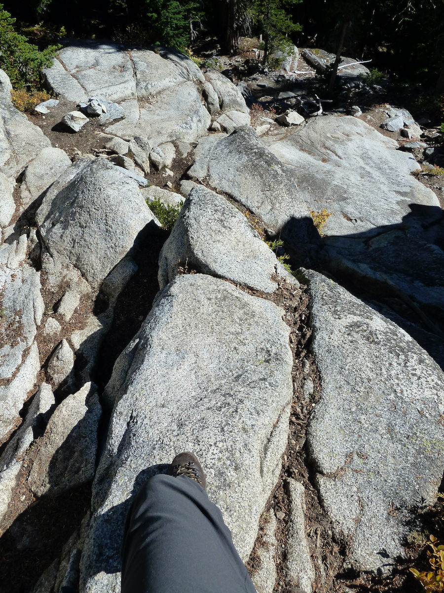 looking down on rocks and dirt trail