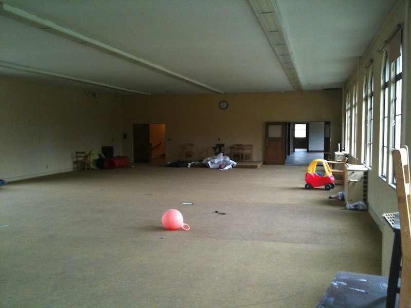 big carpeted room with play toys