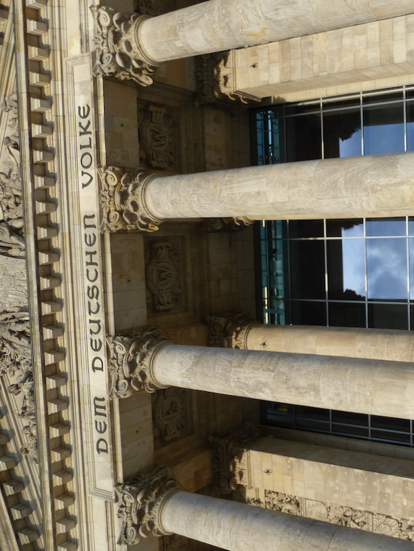 On steps in front of columns