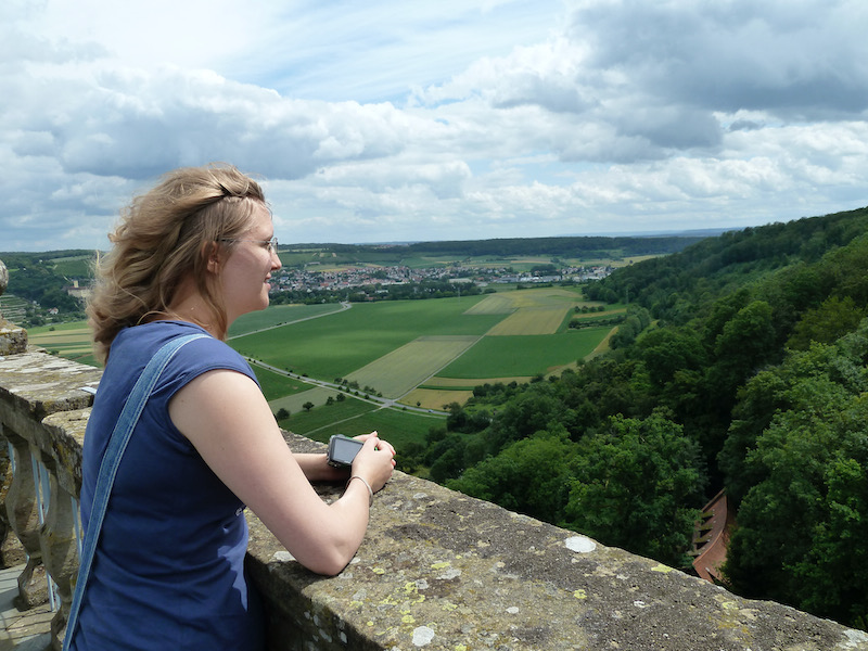 Jessi's hair blowing in the wind, valley beyond