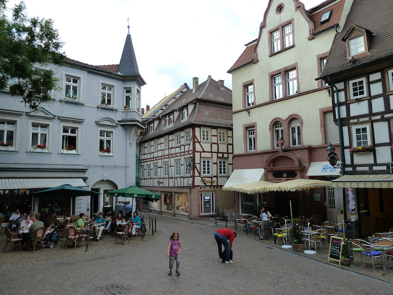 Cobbled square with tables around edge