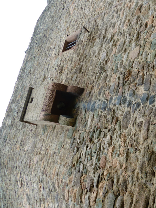 Outset from wall with darkened mark down stones