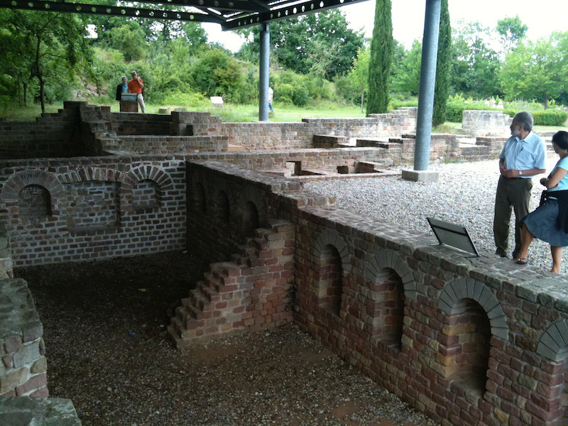 Open basement area with bricke arched connecting passages