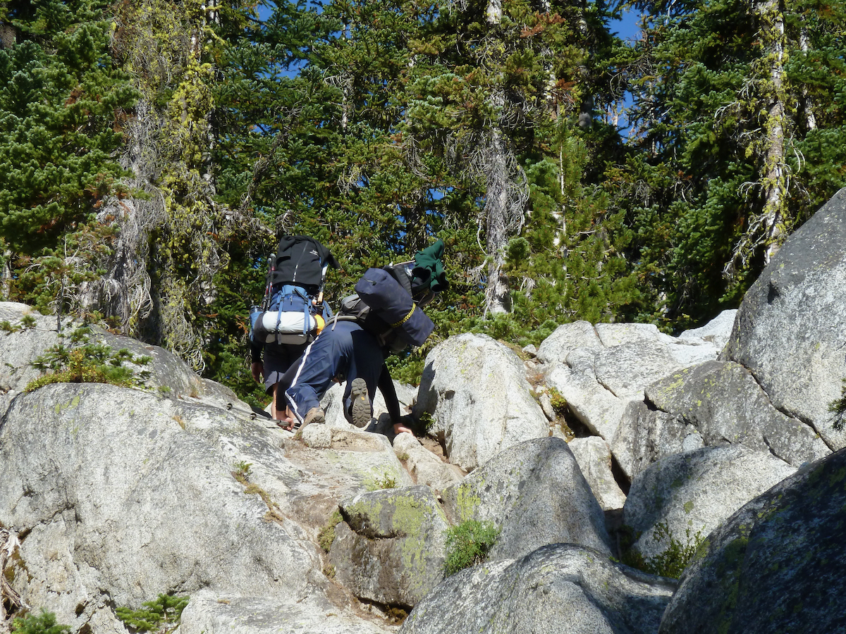 guys climbing above on trail