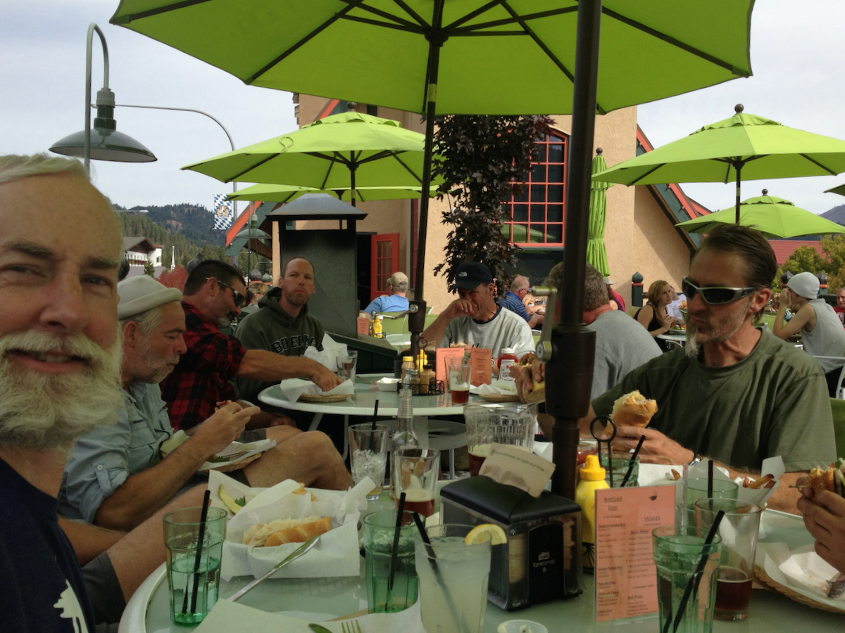 sitting around outside restaurant table in sunshine