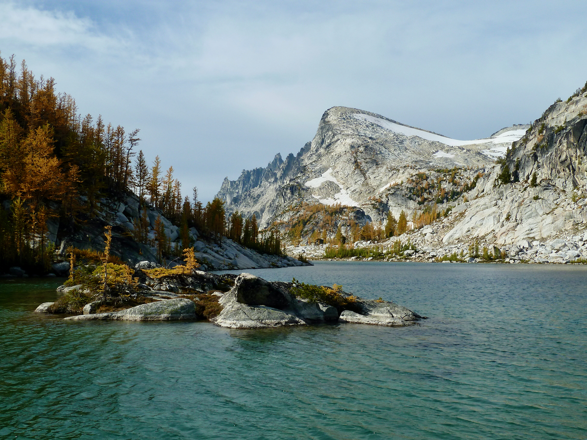 view across lake with small island and peak beyond