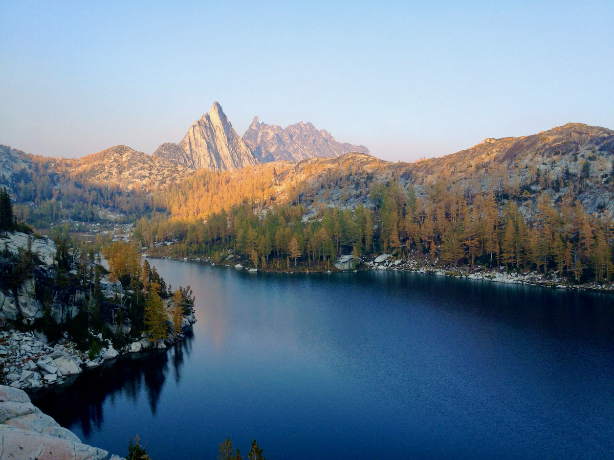 lake in shaddow and peak in sunshine