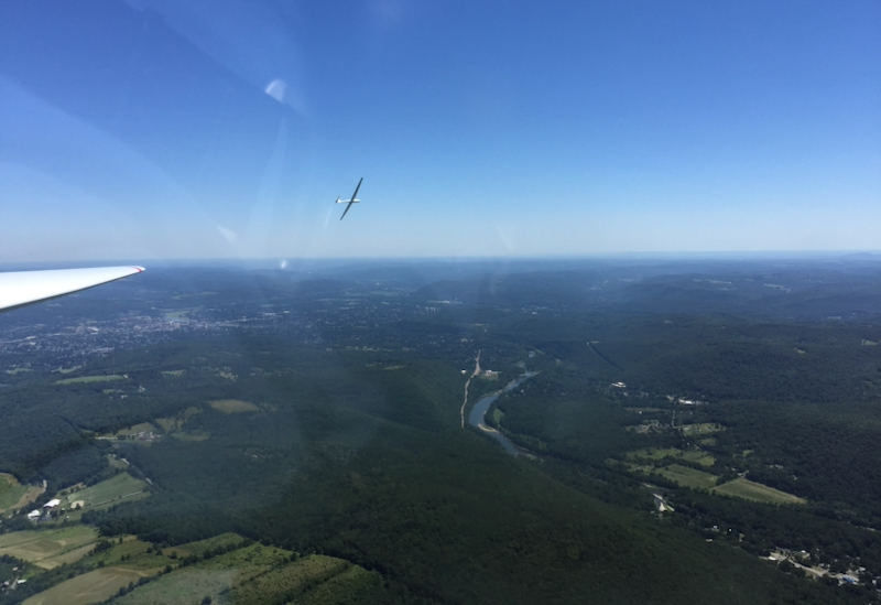 glider at left banking away