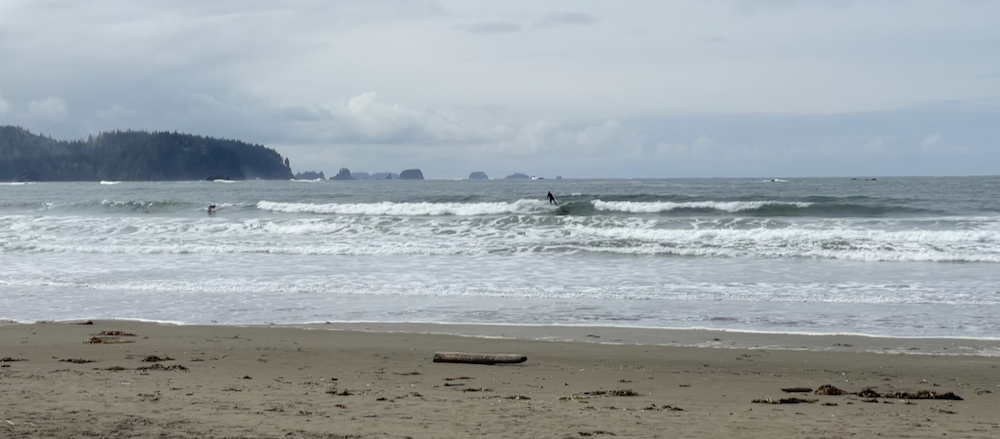 incoming surf with surfer riding