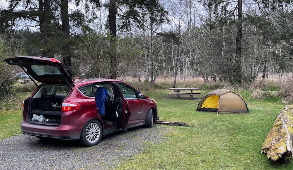 car and tent at campsite