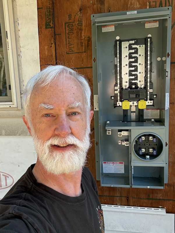 Larry in front of new panel