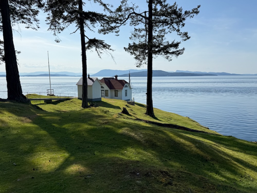 lighthouse buildings at edge of water