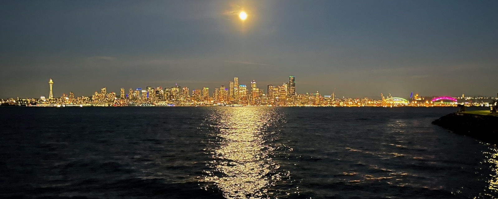 moon and the lights of Seattle across the water