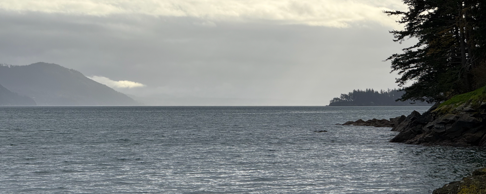 Gray salt water passage and clouds