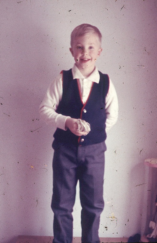 Young Larry dressed up with a vest