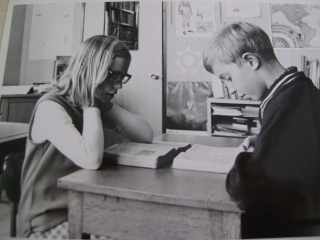 Larry and Marilyn studying at desk